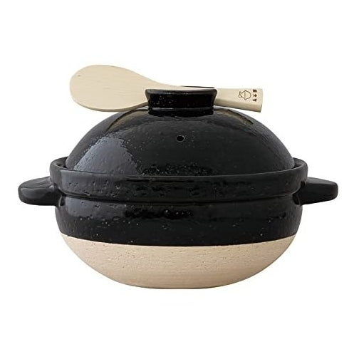 Kamado-san donabe rice cooker on a wooden kitchen counter