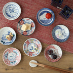 Set of eight Edokko Japanese pattern dinosaur side plates flat lay