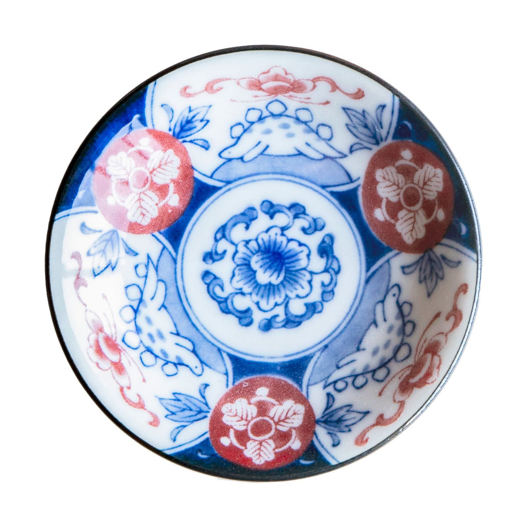 Close-up of Edokko blue floral medallion dinosaur side plate with glossy finish