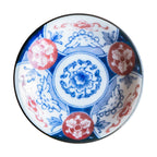 Close-up of Edokko blue floral medallion dinosaur side plate with glossy finish