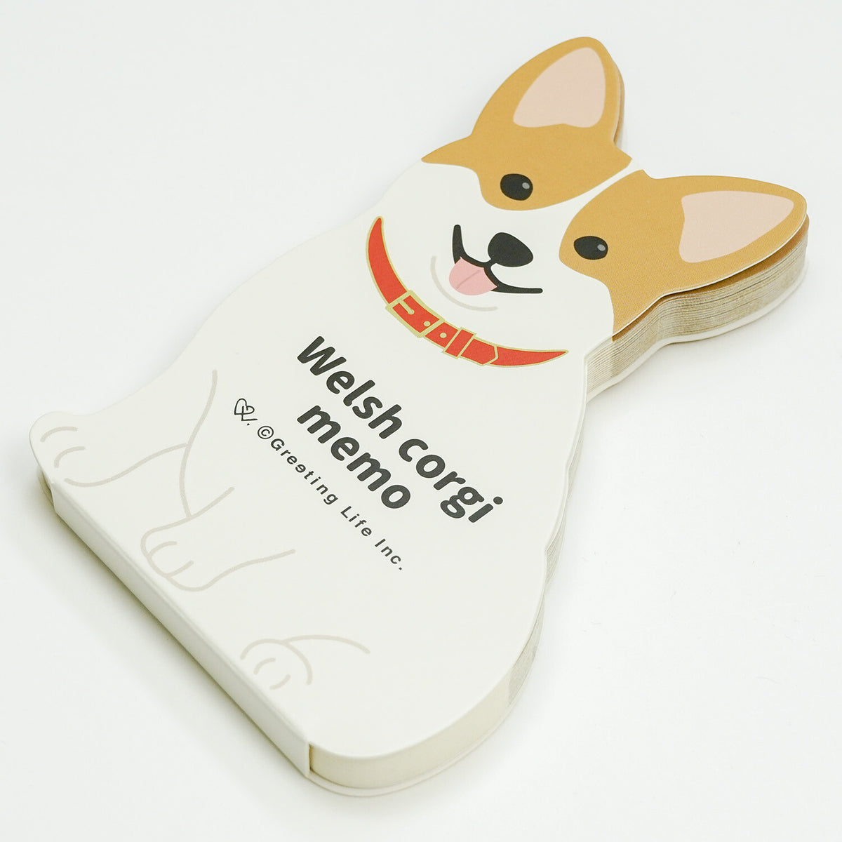 Side view of layered corgi-shaped paper memo pad stack