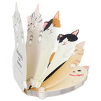 Assorted fanned stack of relaxing cat memo pads