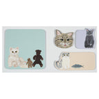 Flat lay of open cat sticky note book revealing white cat and teddy bear design