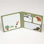 Olive green folding book sticky notes featuring wire-haired terrier and schnauzer illustrations