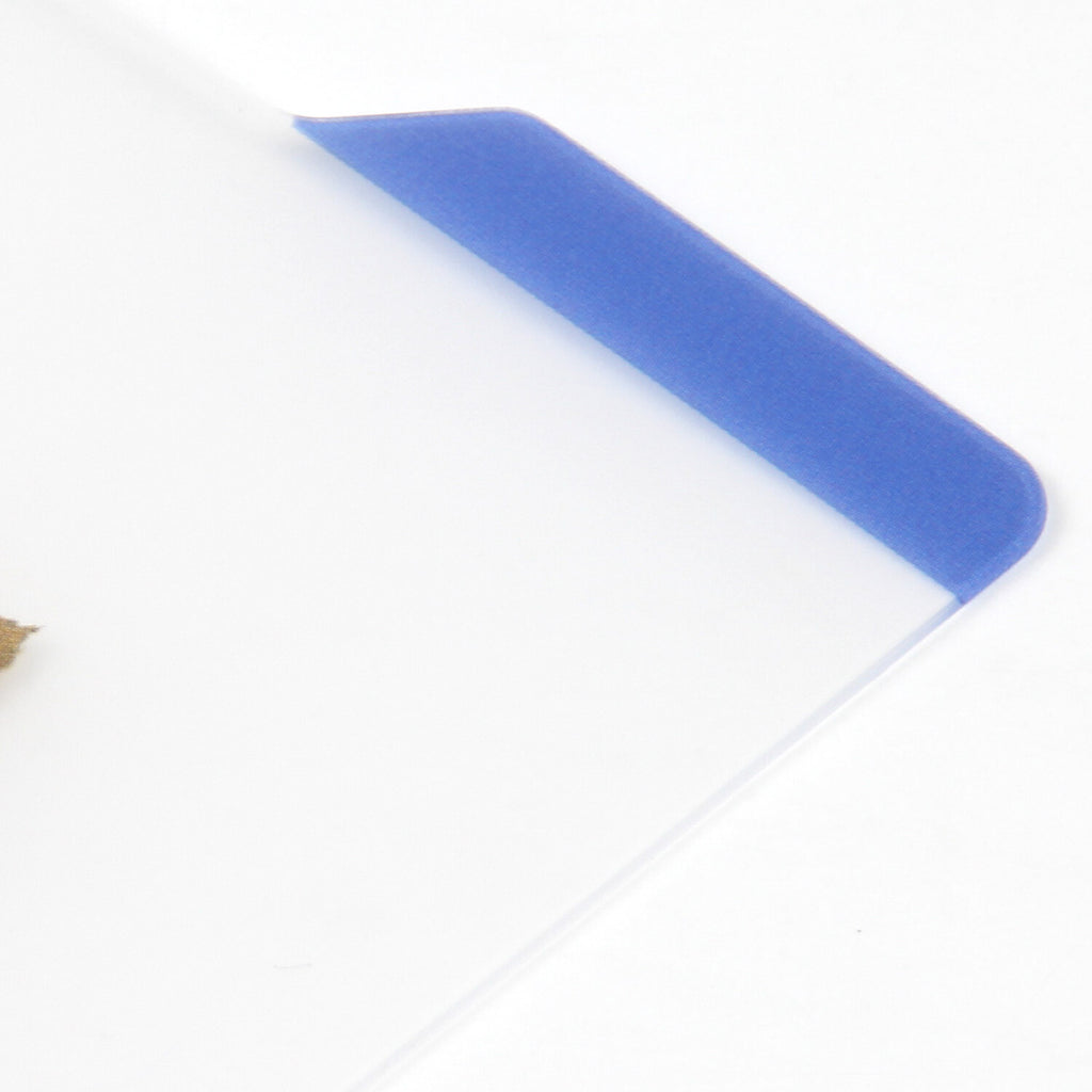 Close-up of blue index tab and smooth polypropylene edge on clear writing board