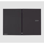 Open Hobonichi Techo 2024 showing front and back covers with brand logo and spine detail