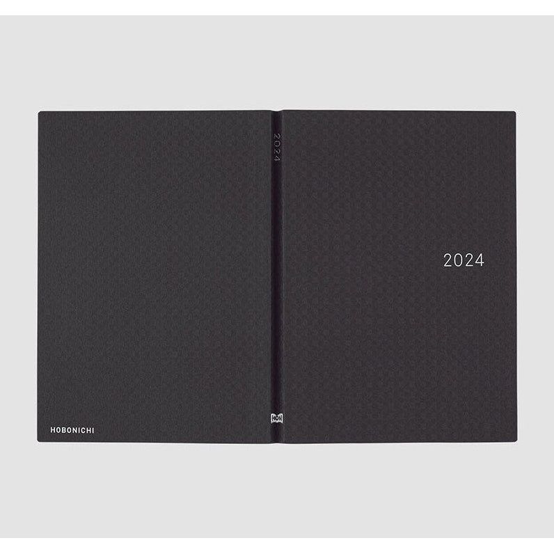 Open Hobonichi Techo 2024 showing front and back covers with brand logo and spine detail