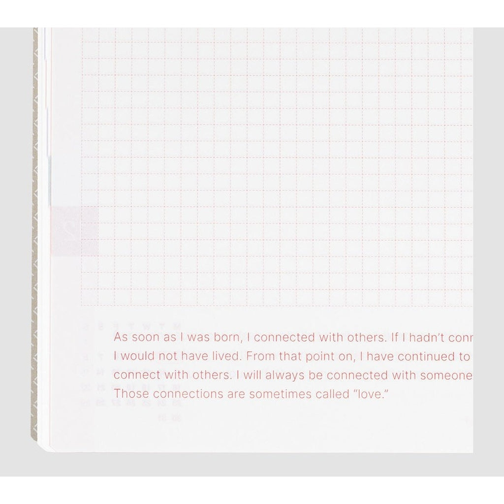 Close-up of red dashed grid paper in Hobonichi Techo 2024 with inspirational quote text