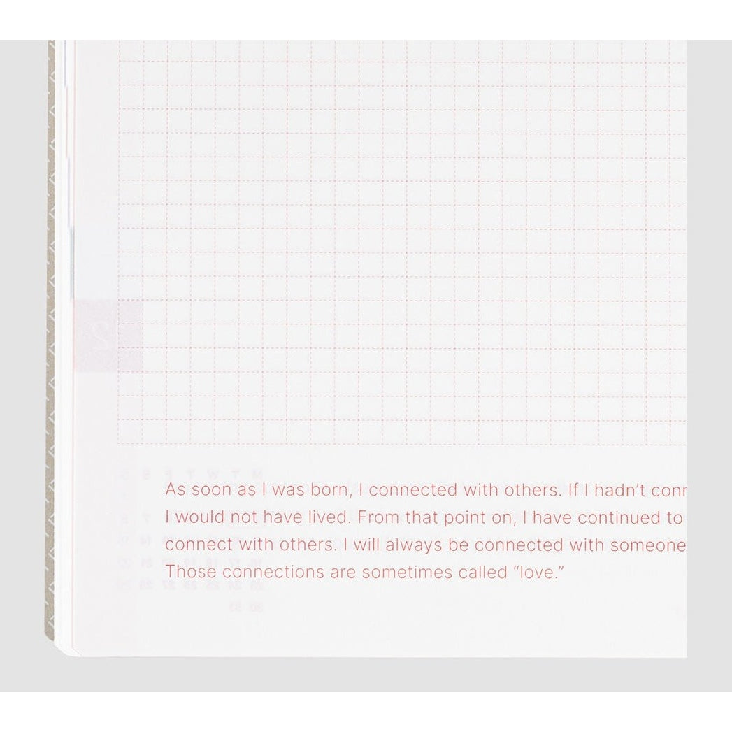 Close-up of red dashed grid paper in Hobonichi Techo 2024 with inspirational quote text
