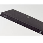 Spine and corner detail of black gingham 2024 hardcover diary showing HON logo and embossed texture