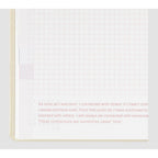 Hobonichi Techo 2024 open page with red dashed grid and inspirational quote text block