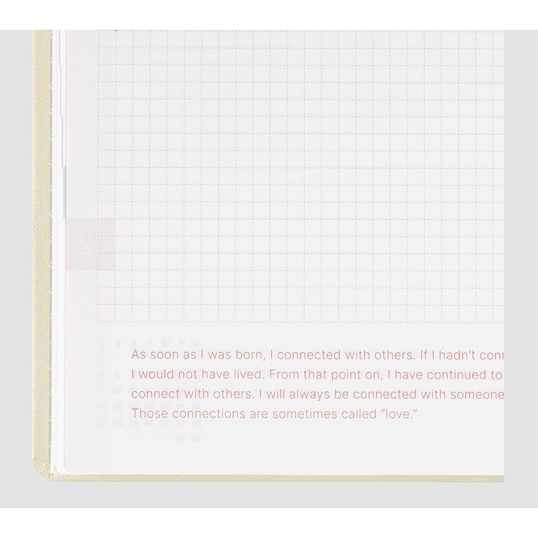 Hobonichi Techo 2024 open page with red dashed grid and inspirational quote text block