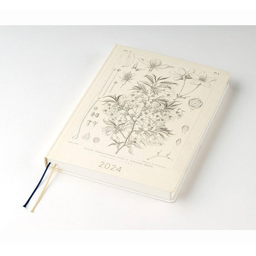 Hobonichi Techo 2024 A5 hardcover diary flat lay with navy and gold ribbons