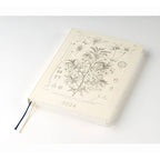 Hobonichi Techo 2024 A5 hardcover diary flat lay with navy and gold ribbons