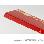 Gold foil spine of 2024 A6 Hobonichi planner featuring globe icon and HON logo