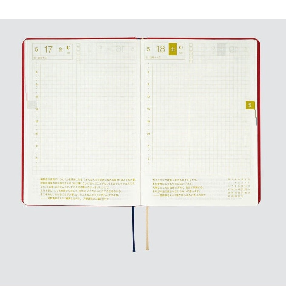 Open spread of Hobonichi Techo 2024 showing grid pages and Japanese date layout