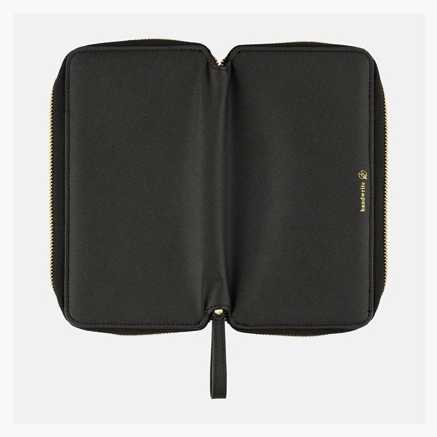 Open Hobonichi Techo Weeks Notte cover flat lay showing inner panels and logo