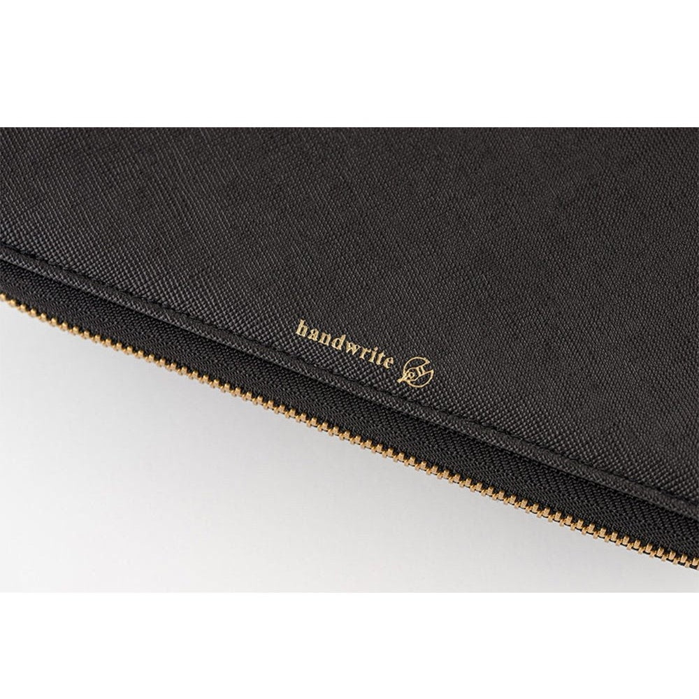 Black textured Hobonichi cover exterior close-up with gold handwrite logo
