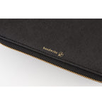 Black textured Hobonichi cover exterior close-up with gold handwrite logo