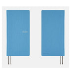 Hobonichi Techo 2024 Weeks Celeste Blue closed notebook with silver foil lettering and ribbons