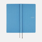 Open Hobonichi Techo 2024 Weeks Celeste Blue showing silver printed cover text and ribbon bookmark