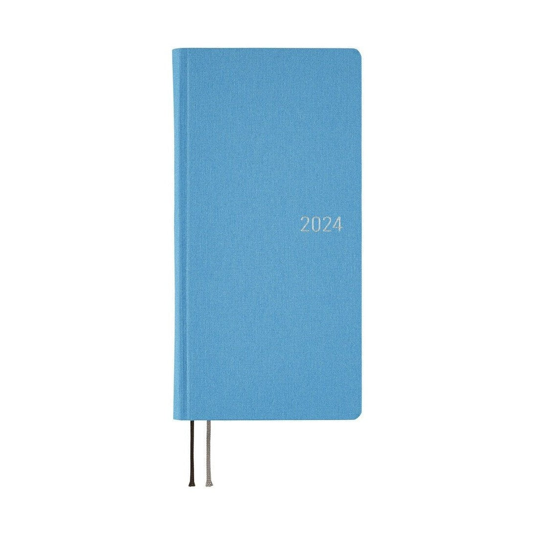 Hobonichi Techo 2024 Weeks Celeste Blue standing upright with light blue fabric cover