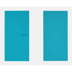 Two upright Hobonichi Techo 2024 diaries with matte aqua blue softcovers