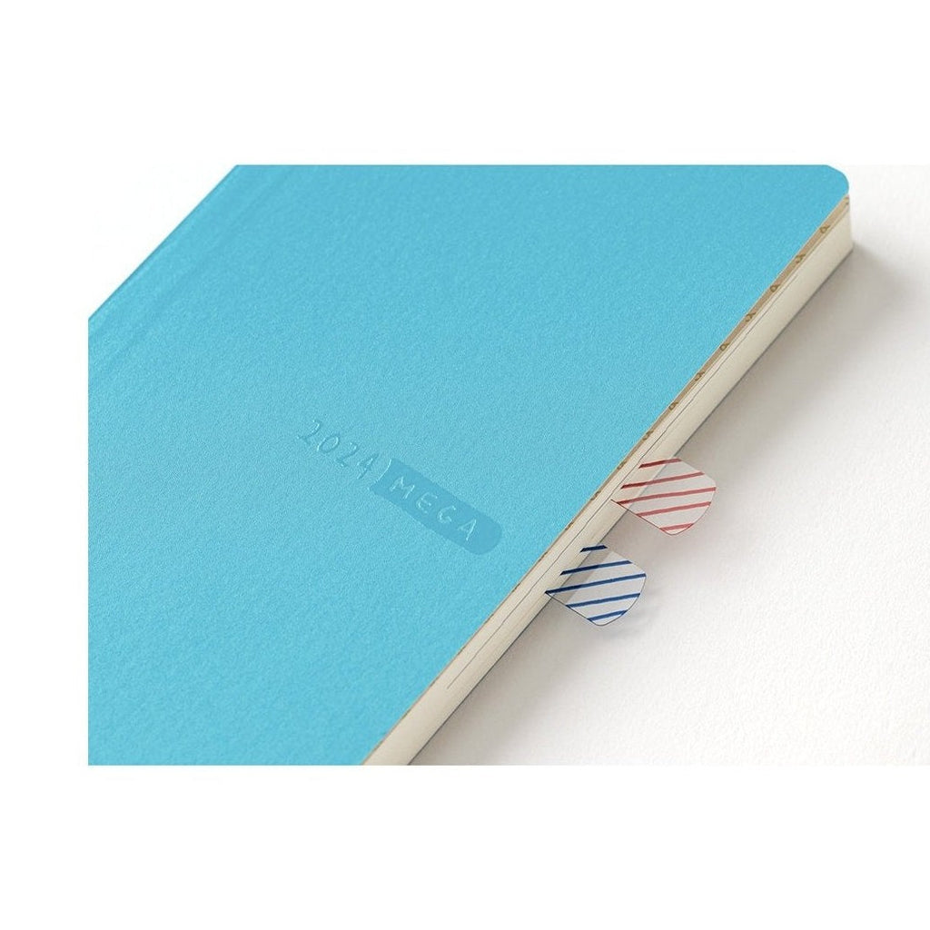 Angled Hobonichi Techo 2024 MEGA with red and blue striped tab markers visible