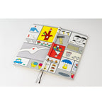 Hobonichi Techo 2024 closed notebook with red elastic band and comic panels