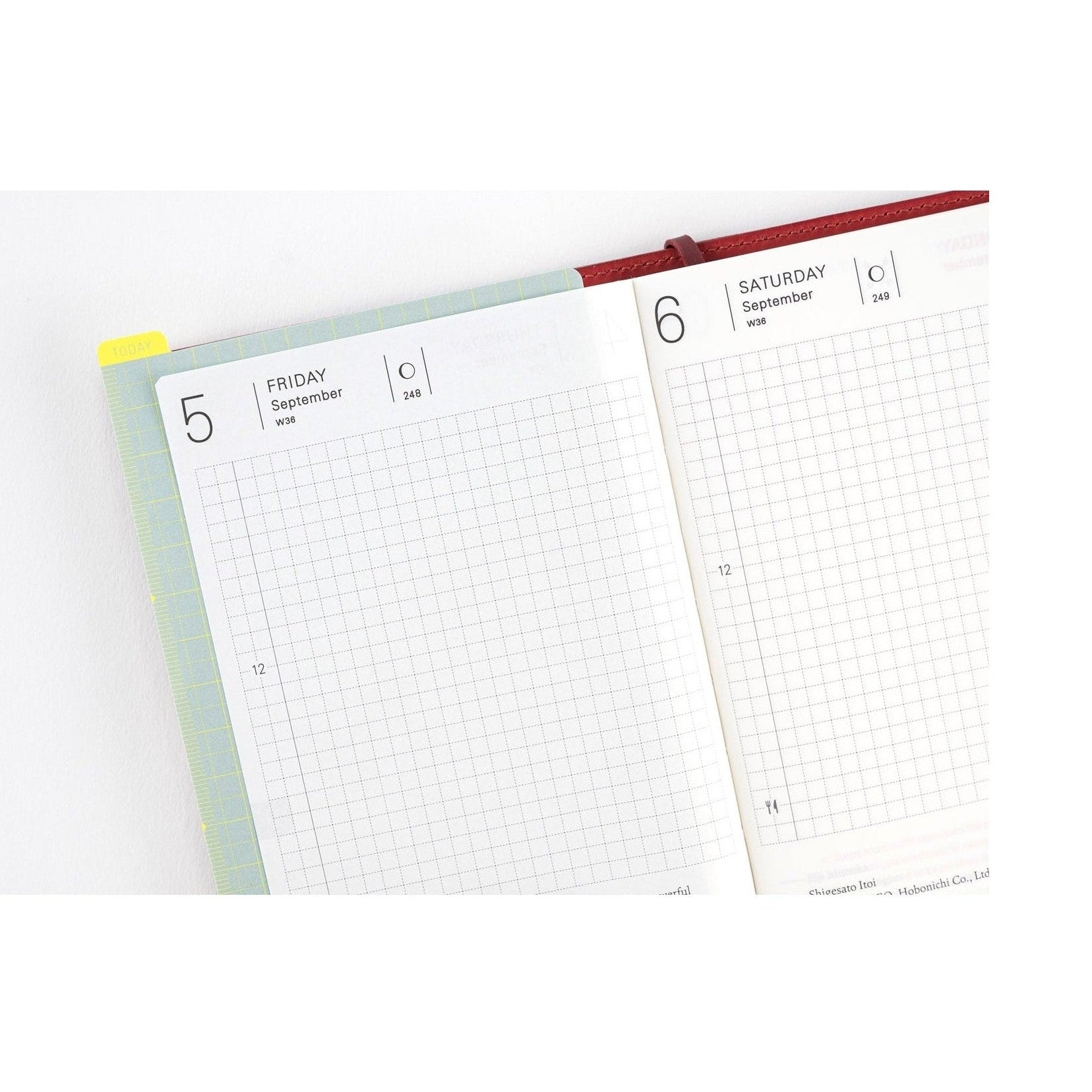 Hobonichi Techo 2025 September weekly spread with yellow today tab and green ruler border