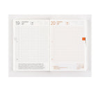 Hobonichi Techo 2025 April weekend spread with orange date headers and dotted grid lines