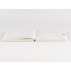 Top-down view of Hobonichi Techo 2025 open planner with subtle dot grid and bookmark tab