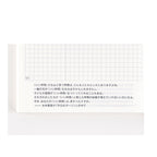 Hobonichi Techo 2025 single page with black dot grid and Japanese text annotations