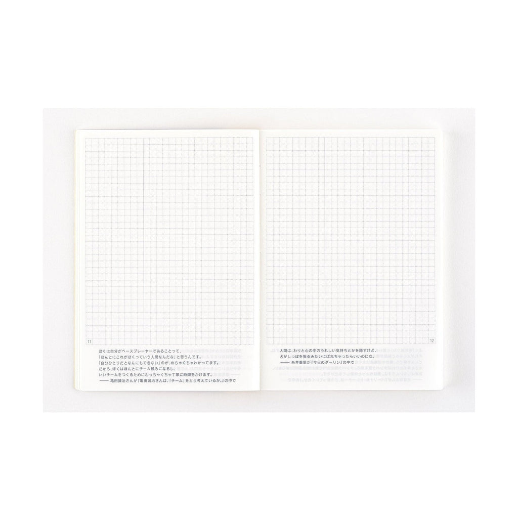Hobonichi Techo 2025 A6 diary open showing minimalist grid pages with Japanese text