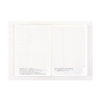 Hobonichi Techo 2025 A6 diary open showing minimalist grid pages with Japanese text