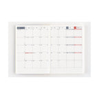 Hobonichi Techo 2025 weekly planner spread with color-coded weekends and bilingual dates