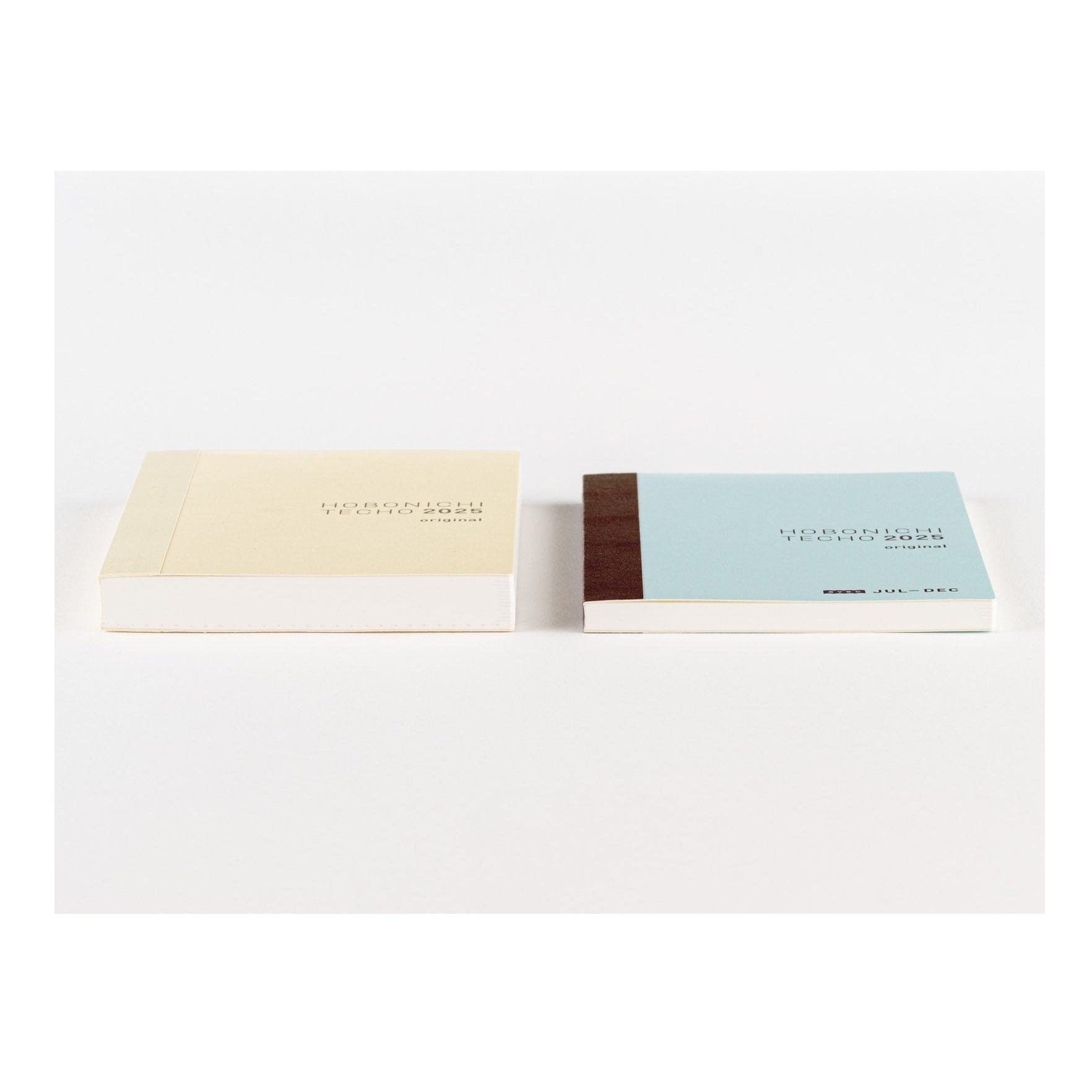 Hobonichi Techo 2025 A6 diary set in cream and blue covers showing spine details