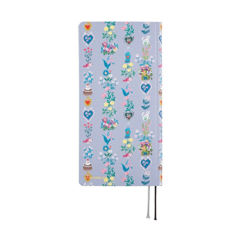 Hobonichi Techo 2025 Weeks closed light blue cover featuring Yumi Kitagishi fairy tale vertical pattern