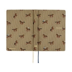 Open Hobonichi Techo 2026 A6 planner with grid pages and ribbon bookmarks