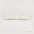 Hobonichi Techo 2026 One Piece A6 daily planner open spread with grid layout and blue Japanese text