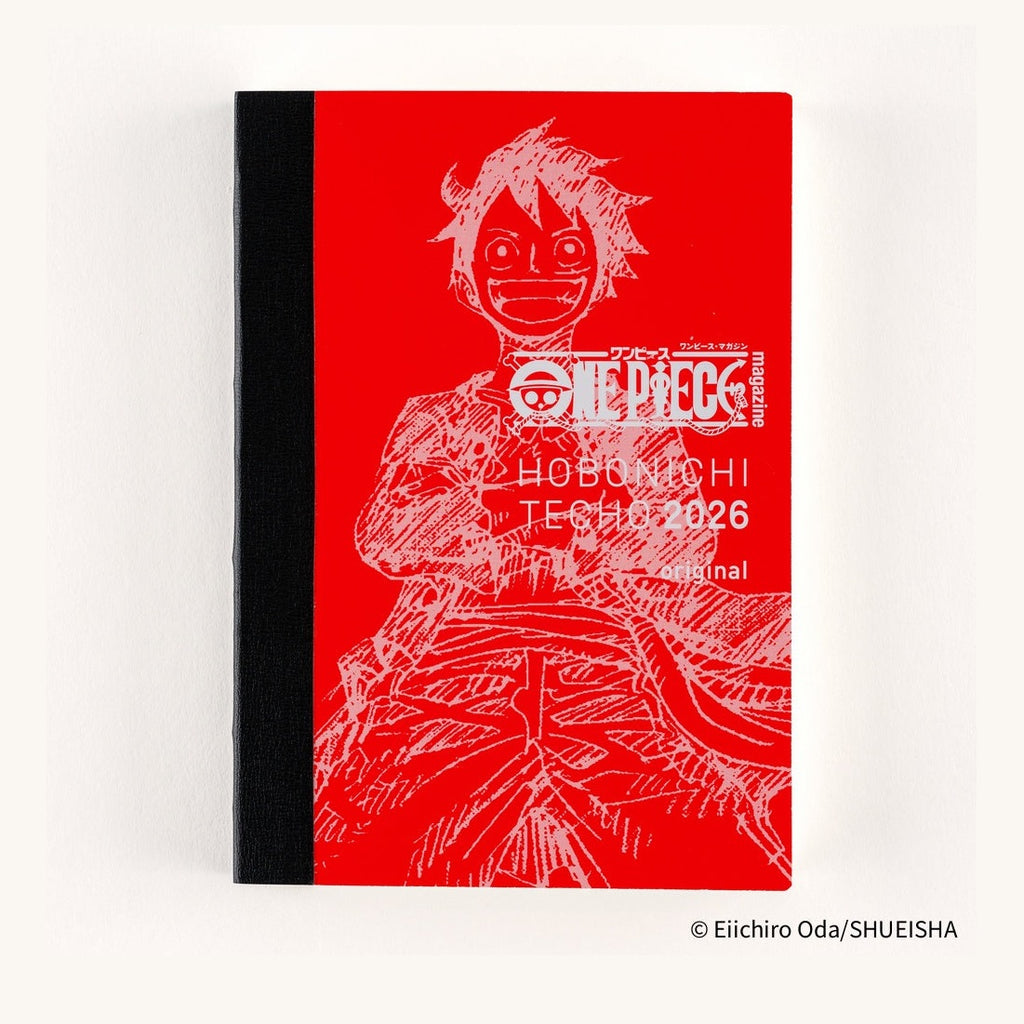 Red Hobonichi Techo 2026 One Piece hardcover planner featuring Luffy line art and white typography