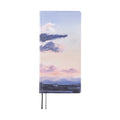Hobonichi Techo 2026 Weeks ENG front cover featuring purple and pink cloud landscape with rounded corners