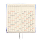 Hobonichi Techo 2026 Weeks ENG planner open showing weekly grid layout with cream paper and ribbon bookmark