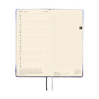 Hobonichi Techo 2026 Weeks ENG April spread featuring weekly calendar and blank grid page with textured cover
