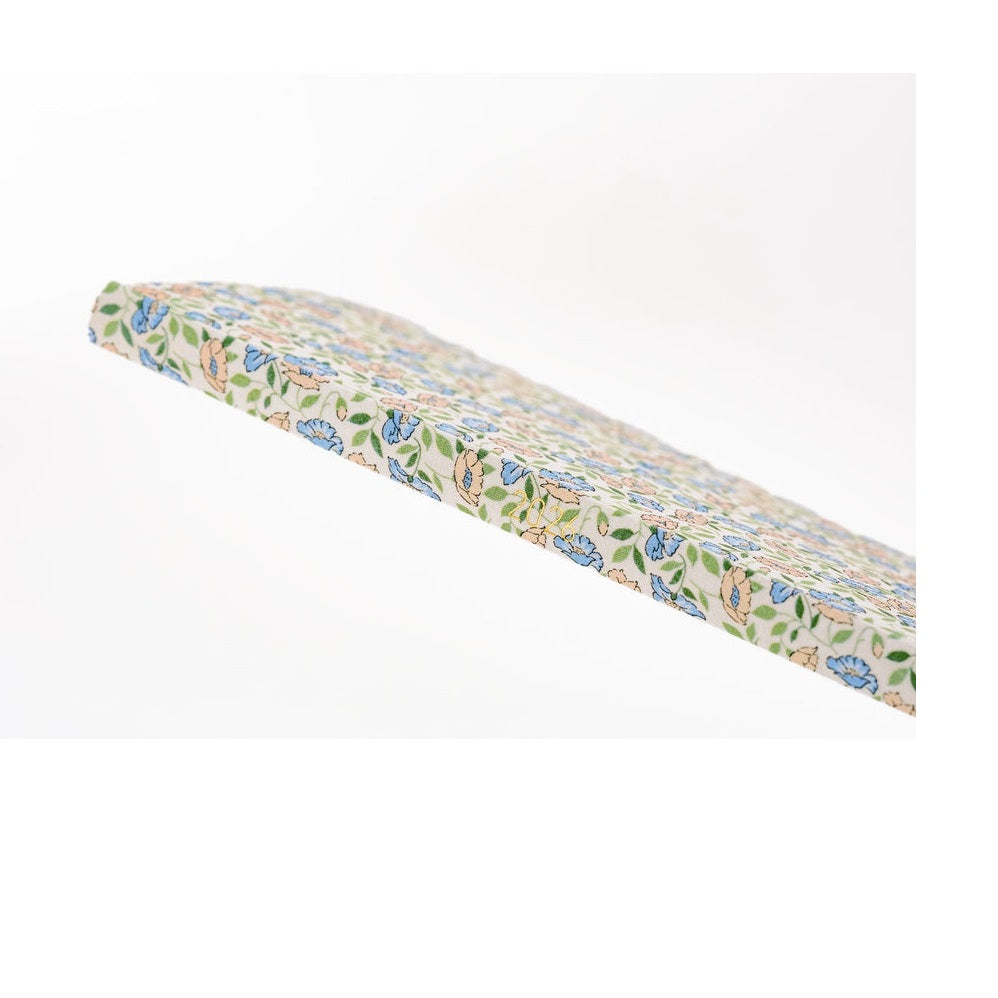 Side profile of flexible light hardcover Hobonichi 2026 Liberty Sasha Kiora diary with gold foil