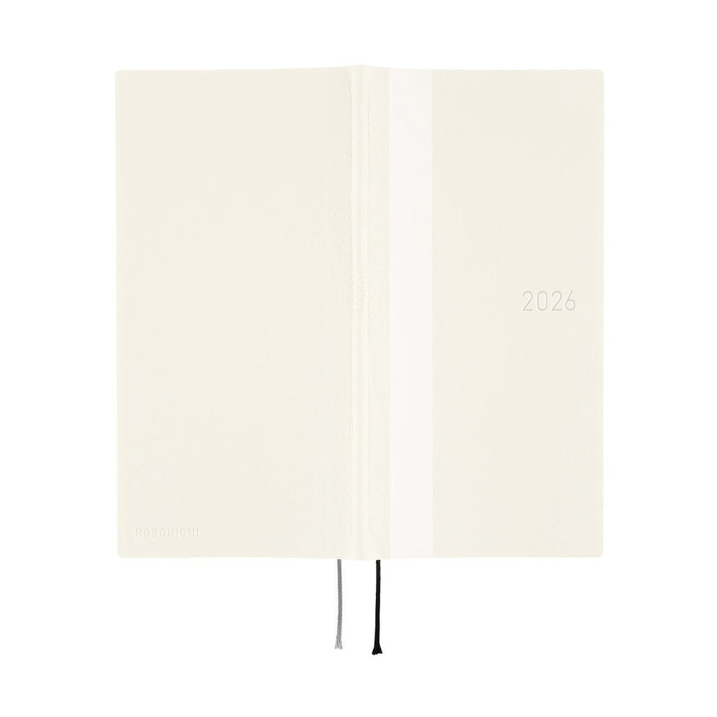 Hobonichi Techo 2026 open diary cream cover with embossed branding and ribbons
