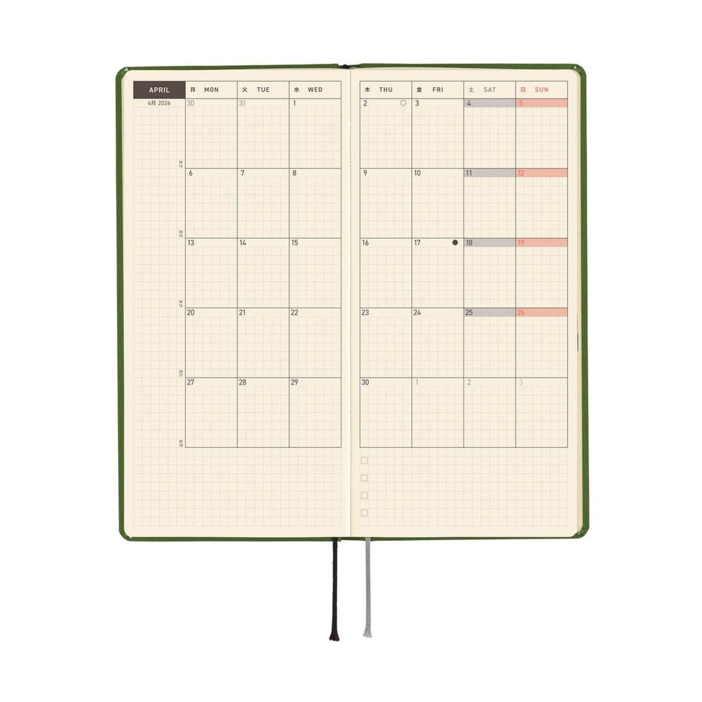 Open Hobonichi Techo 2026 weekly planner with color-coded weekend cells and flexible spine design
