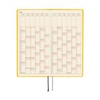 Open Hobonichi 2026 planner displaying yearly calendar grid with pink and gray date highlights