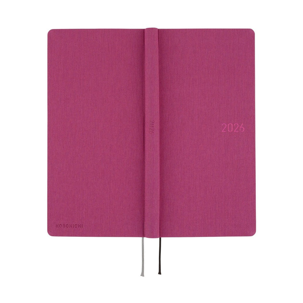 Open Hobonichi Techo 2026 Weeks MEGA ENG showing spine and cover texture in Peony Purple