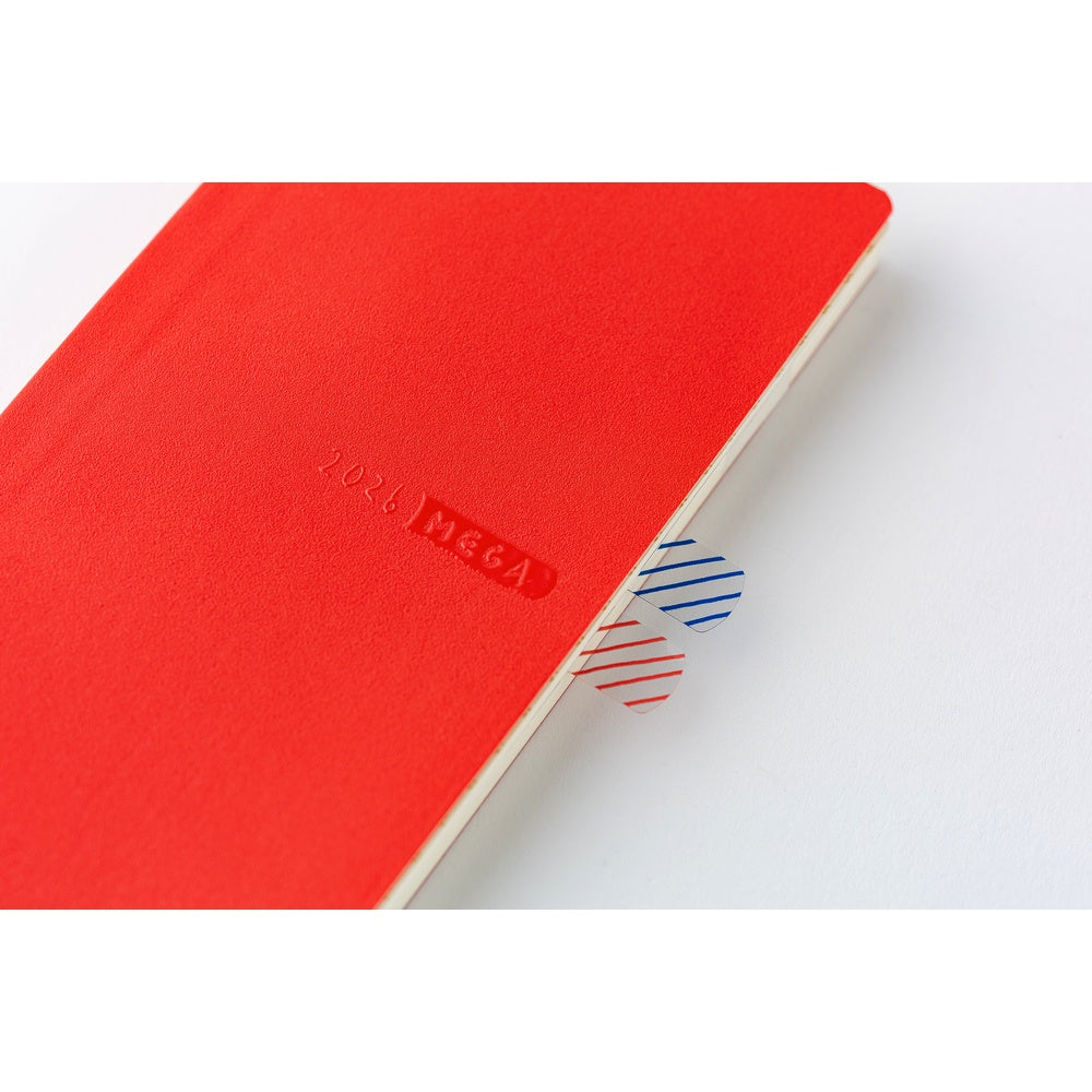 Reusable clear sticky notes peeking from tomato red Hobonichi Techo 2026 planner pages